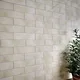 A wall close-up of a Subway Wall Tile TL 06427 Eterna Almond 12 x 4 inch Ceramic Glossy Finish - 8 mm  | Suitable for Accent / Feature Walls, Bathroom, Kitchen Wall & Backsplashes with a Glossy finish available at Material Depot in Bangalore