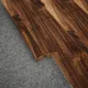 A close-up of a MDF Reducer R Profile Aristo Premium PM 00364 I | 8 ft x 16 mm x 12 mm | Compatible for Laminate Wood Floor LF 00247 available at Material Depot in Bangalore