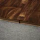A close-up of a MDF T Profile Aristo Premium PM 00364 Q | 8 ft x 25 mm x 12 mm | Compatible for Laminate Wood Floor LF 00247 available at Material Depot in Bangalore