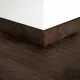 A close-up of a MDF Skirting Aristo Premium PM 00365 E | 8 ft x 3 Inch | Compatible for Laminate Wood Floor LF 00250 available at Material Depot in Bangalore