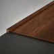 A close-up of a MDF Edge Profile Aristo Premium PM 00371 T | 8 ft x 18 mm x 12 mm | Compatible for Laminate Wood Floor LF 00251 available at Material Depot in Bangalore