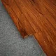 A close-up of a MDF Reducer R Profile Aristo Premium PM 00366 I | 8 ft x 16 mm x 12 mm | Compatible for Laminate Wood Floor LF 00252 available at Material Depot in Bangalore