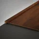 A close-up of a MDF Edge Profile Aristo Premium PM 00366 T | 8 ft x 18 mm x 12 mm | Compatible for Laminate Wood Floor LF 00252 available at Material Depot in Bangalore