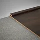 A close-up of a MDF Corner Beading Profile Aristo Premium PM 00355 | 8 ft x 12 mm x 12 mm | Compatible for Laminate Wood Floor LF 00254 available at Material Depot in Bangalore
