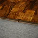 A close-up of a MDF T Profile Gleam PM 00383 Q | 8 ft x 25 mm x 12 mm | Compatible for Laminate Wood Floor LF 00262 available at Material Depot in Bangalore