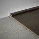 A close-up of a MDF Corner Beading Profile Gleam PM 00387 | 8 ft x 12 mm x 12 mm | Compatible for Laminate Wood Floor LF 00264 available at Material Depot in Bangalore