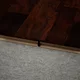 A close-up of a MDF T Profile Gleam PM 00384 P | 8 ft x 23 mm x 12 mm | Compatible for Laminate Wood Floor LF 00265 available at Material Depot in Bangalore