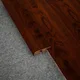 A close-up of a MDF Reducer R Profile Heirloom PM 00350 I | 8 ft x 16 mm x 12 mm | Compatible for Laminate Wood Floor LF 00269 available at Material Depot in Bangalore