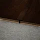 A close-up of a MDF T Profile Heirloom PM 00349 N | 8 ft x 16 mm x 12 mm | Compatible for Laminate Wood Floor LF 00271 available at Material Depot in Bangalore
