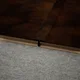 A close-up of a MDF T Profile Timberlux PM 00376 N | 8 ft x 16 mm x 12 mm | Compatible for Laminate Wood Floor LF 00278 available at Material Depot in Bangalore