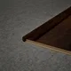 A close-up of a MDF L Nosing Profile Timberlux PM 00376 X | 8 ft x 25 x 45 x 12 mm | Compatible for Laminate Wood Floor LF 00278 available at Material Depot in Bangalore