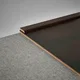 A close-up of a MDF Corner Beading Profile Edge Flow PM 00378 C | 8 ft x 25 mm x 12 mm | Compatible for Laminate Wood Floor LF 00281 available at Material Depot in Bangalore