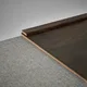 A close-up of a MDF Corner Beading Profile Aqua Lock PM 00402 B | 8 ft x 18 mm x 12 mm | Compatible for Laminate Wood Floor LF 00285 available at Material Depot in Bangalore
