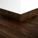 A close-up of a MDF Skirting Aqua Lock PM 00402 E | 8 ft x 3 Inch | Compatible for Laminate Wood Floor LF 00285 available at Material Depot in Bangalore