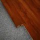A close-up of a MDF Reducer R Profile Aqua Lock PM 00403 L | 8 ft x 25 mm x 12 mm | Compatible for Laminate Wood Floor LF 00286 available at Material Depot in Bangalore