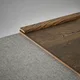 A close-up of a MDF Corner Beading Profile Aqua Lock PM 00406 | 8 ft x 12 mm x 12 mm | Compatible for Laminate Wood Floor LF 00289 available at Material Depot in Bangalore