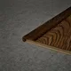 A close-up of a MDF L Nosing Profile Aqua Lock PM 00406 W | 8 ft x 25 x 25 x 12 mm | Compatible for Laminate Wood Floor LF 00289 available at Material Depot in Bangalore