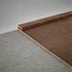 A close-up of a MDF Corner Beading Profile Aqua Lock PM 00409 B | 8 ft x 18 mm x 12 mm | Compatible for Laminate Wood Floor LF 00292 available at Material Depot in Bangalore