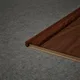 A close-up of a MDF L Nosing Profile Aqua Lock PM 00409 W | 8 ft x 25 x 25 x 12 mm | Compatible for Laminate Wood Floor LF 00292 available at Material Depot in Bangalore