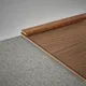 A close-up of a MDF Corner Beading Profile Herringbone PM 00392 C | 8 ft x 25 mm x 12 mm | Compatible for Laminate Wood Floor LF 00295 available at Material Depot in Bangalore