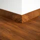 A close-up of a MDF Skirting Herringbone PM 00392 E | 8 ft x 3 Inch | Compatible for Laminate Wood Floor LF 00295 available at Material Depot in Bangalore