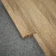 A close-up of a MDF Reducer R Profile Herringbone PM 00394 J | 8 ft x 18 mm x 12 mm | Compatible for Laminate Wood Floor LF 00296 available at Material Depot in Bangalore