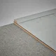 A close-up of a WPC Corner Beading Profile Stone Core TF 00003 D | 8 ft x 25 mm x 12 mm | Compatible for SPC Floor SP 00066 available at Material Depot in Bangalore