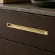 HA 00190 D Ottr Concealed Handle Antique Brass Finish 18in â close-up of brass handle set into dark wood drawer