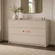 HA 00203 K Ottr Concealed Handle Rose Gold Dual Tone Finish 8in â rose gold copper handle on cream chest of drawers
