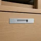 HA 00203 Q Ottr Concealed Handle Grey Chrome Finish 12in â close-up of brushed silver handle on oak drawer