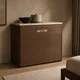 HA 00205 I Ottr Concealed Handle Stainless Steel Chrome Finish 24in â champagne bronze handle on walnut chest of drawers