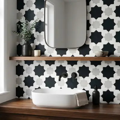 Modern kitchen walkthrough with black-and-white geometric moroccan backsplash tile and matte black marble countertop