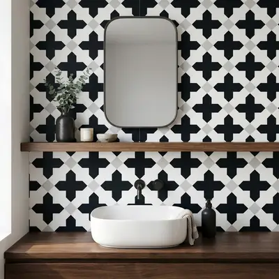 Modern kitchen walkthrough with oak wood laminate, black marble countertop, and geometric black-and-white backsplash tile