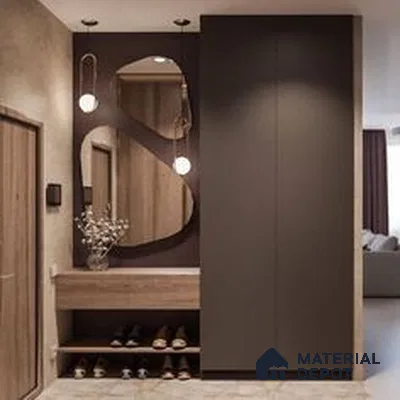A kitchen with wooden cabinets and white counter tops, along with an island in the middle of the middle of the room with wood flooring and white cabinets and black counter tops is lit by recessed lighting on the