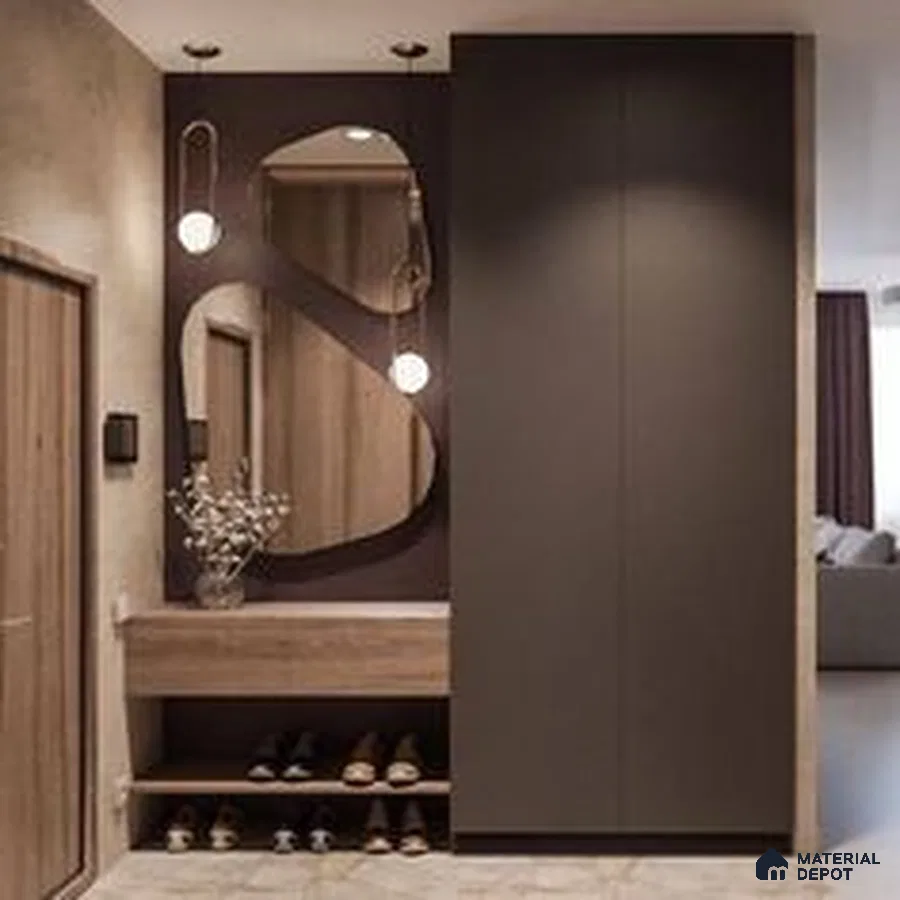 A kitchen with wooden cabinets and white counter tops, along with an island in the middle of the middle of the room with wood flooring and white cabinets and black counter tops is lit by recessed lighting on the