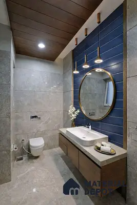 Modern bathroom with grey marble tiles, blue horizontal wall tiles, and wood finish floating vanity