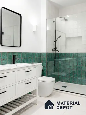 Modern bathroom with green square wall tiles and white matte floor tiles