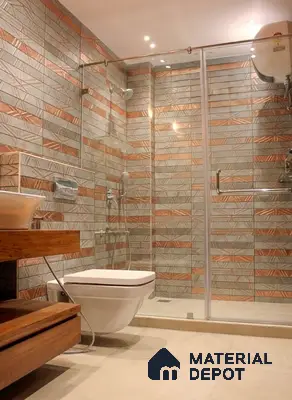 Modern bathroom with geometric copper and grey wall tiles and beige floor tiles