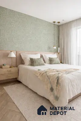 Scandinavian bedroom with sage green abstract wallpaper, beige suede upholstered bed, and light oak wooden flooring