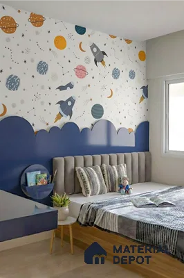 Modern kids room with space-themed wallpaper, blue painted wall panel, and upholstered bed in Alpine ECO Doddanekundi 3 BHK apartment Bengaluru