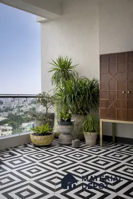 Modern balcony with black-and-white geometric floor tiles and wooden cabinet