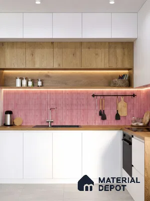 Scandinavian kitchen with pink kitkat backsplash tile, white laminate cabinets, and oak wood laminate