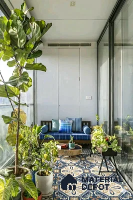 Eclectic balcony with blue and beige moroccan patterned floor tiles and wooden seating of 4 BHK apartment in Aparna Elina Yeshwanthpur in Bengaluru