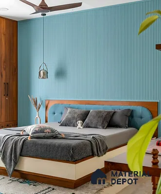 Modern bedroom with blue fluted wall panels, walnut wood wardrobe, and upholstered bed of 4 BHK apartment in Aparna Elina Yeshwanthpur in Bengaluru