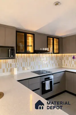 Modern kitchen with taupe matte laminate cabinets, white quartz countertop, and beige geometric backsplash tiles