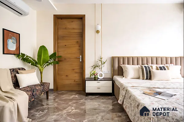 Modern bedroom with taupe suede upholstered bed, natural wood door, and brown marble floor tile