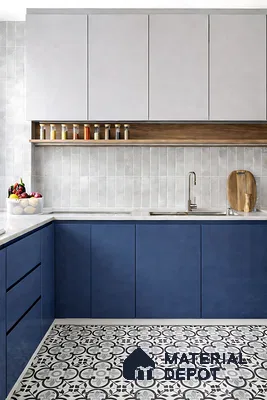 Modern dual tone kitchen with blue laminate base cabinets, white laminate wall cabinets, and patterned black-and-white floor tiles