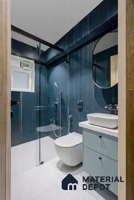 Modern bathroom with deep blue vertical wall tiles and frosty white floor tiles
