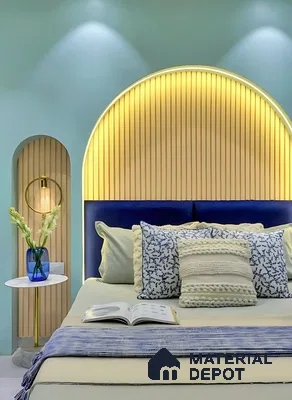 Modern bedroom with light wood fluted panels, pastel blue wall paint, and navy upholstered headboard