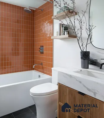 Modern bathroom with terracotta orange wall tiles, marble-look vanity countertop, and fluted wood laminate cabinet of 3 BHK apartment in Arvind Oasis Nagasandra Bengaluru